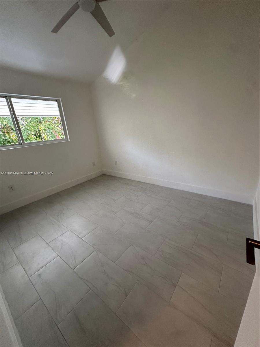 798 Crandon Boulevard, Unit 38C Key Biscayne, FL 33149 - Photo 10 of 33 an empty room with a window
