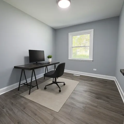 a workspace with furniture and a window