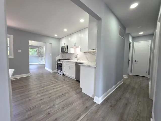 a view of kitchen with wooden floor