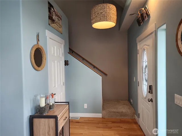a view of a hallway with washer and dryer