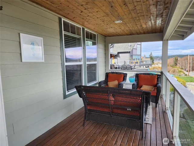 a sitting room with furniture