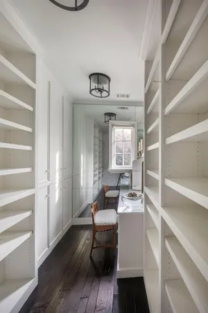a room with a chair and wooden floor