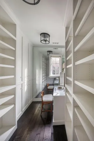 a room with a chair and wooden floor