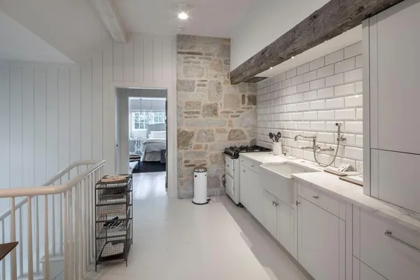 a bathroom with a double vanity sink toilet and shower