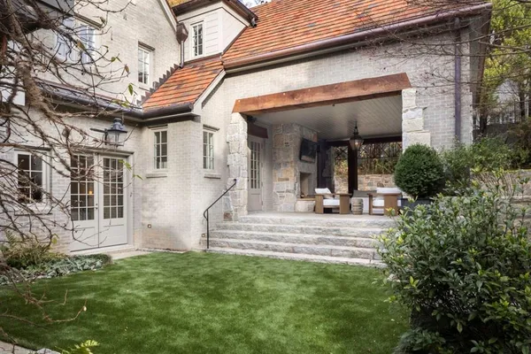 a view of a house with a yard porch and sitting area