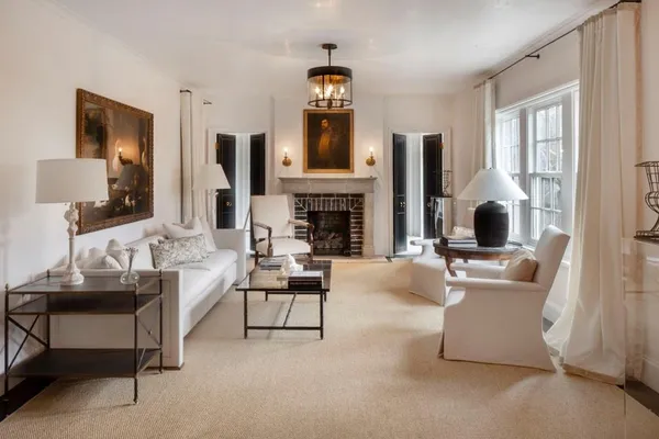 a living room with furniture and fireplace