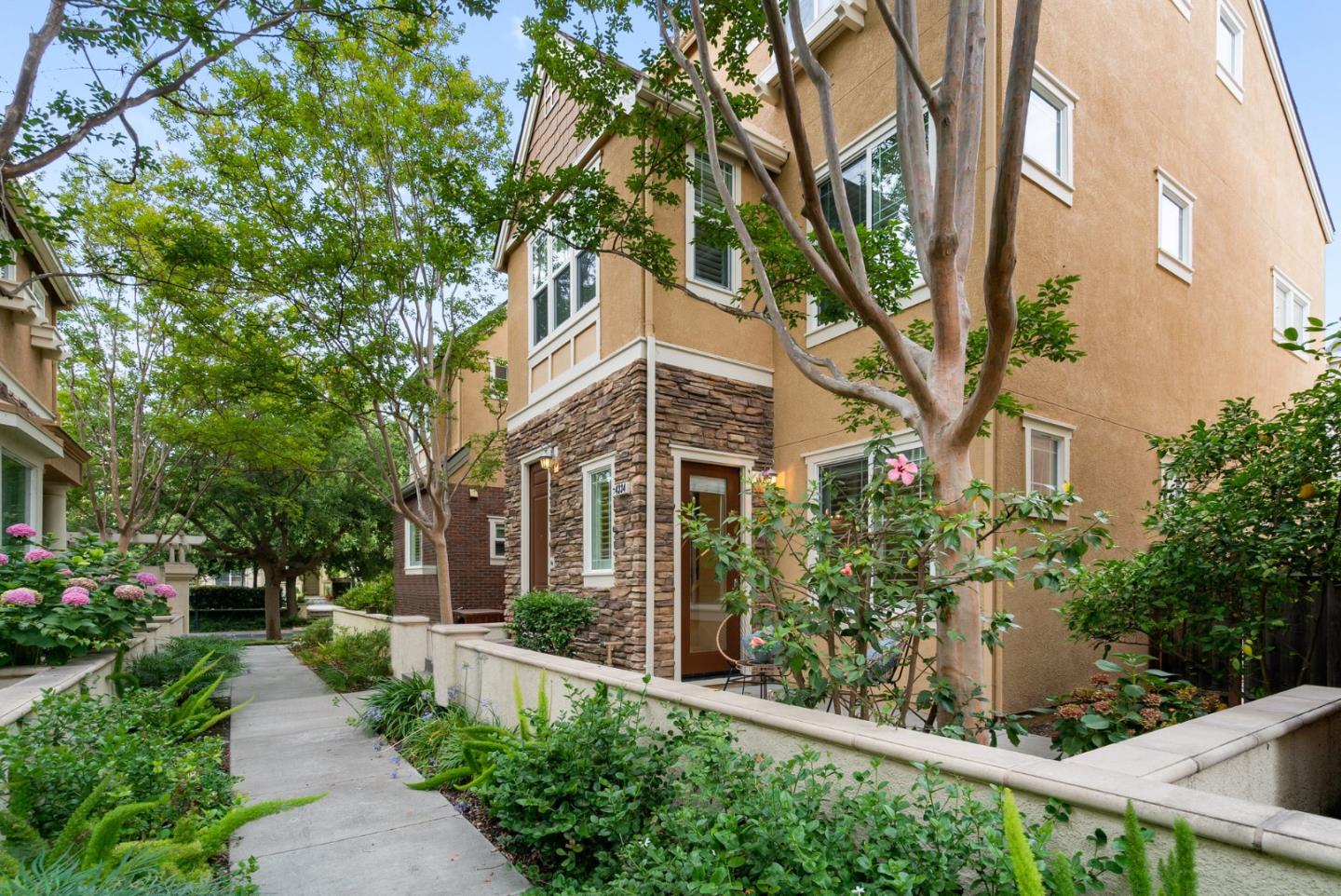 4334 Watson Circle Santa Clara, CA 95054 - Photo 1 of 38 a front view of a house with a yard and fountain in middle