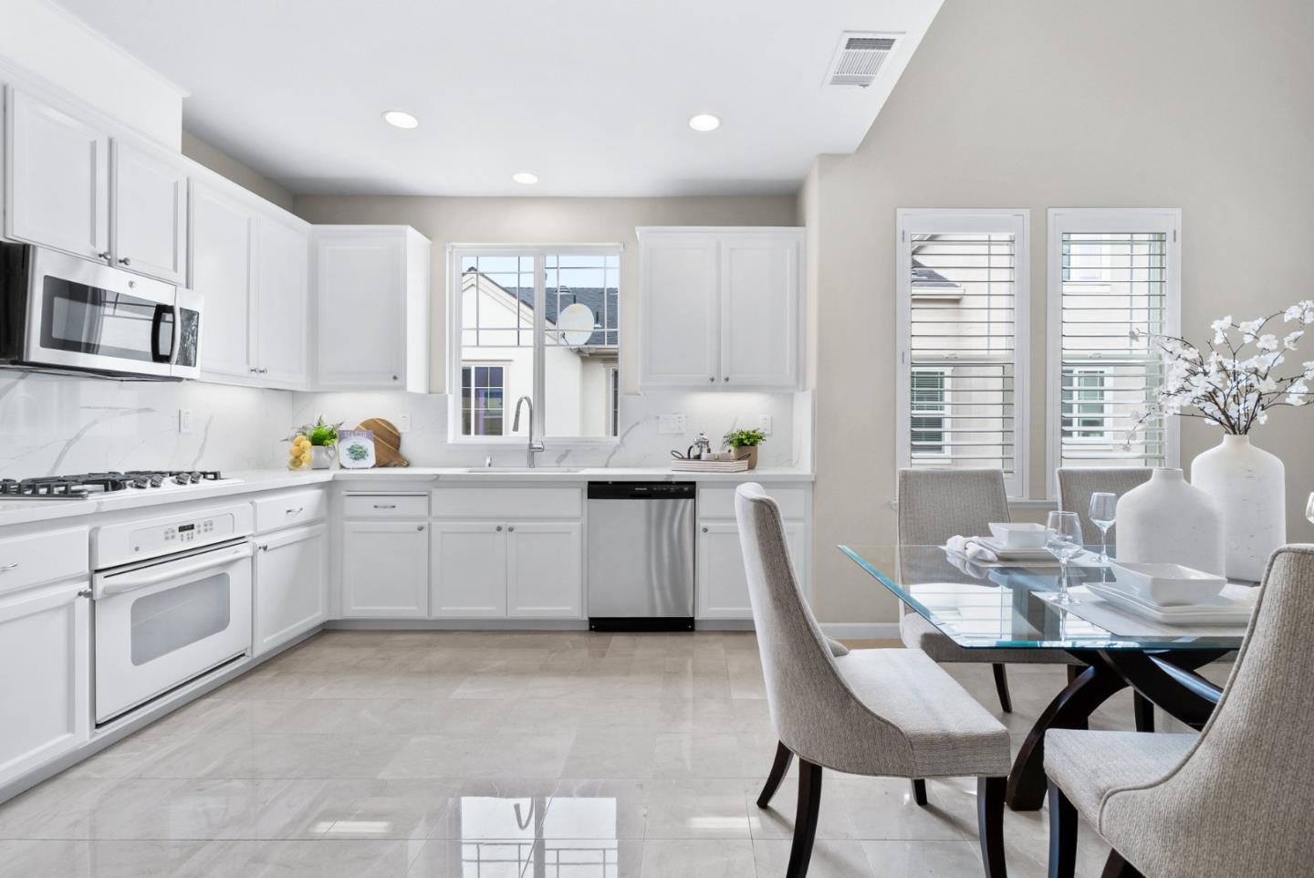 4334 Watson Circle Santa Clara, CA 95054 - Photo 13 of 38 a kitchen with granite countertop white cabinets and stainless steel appliances