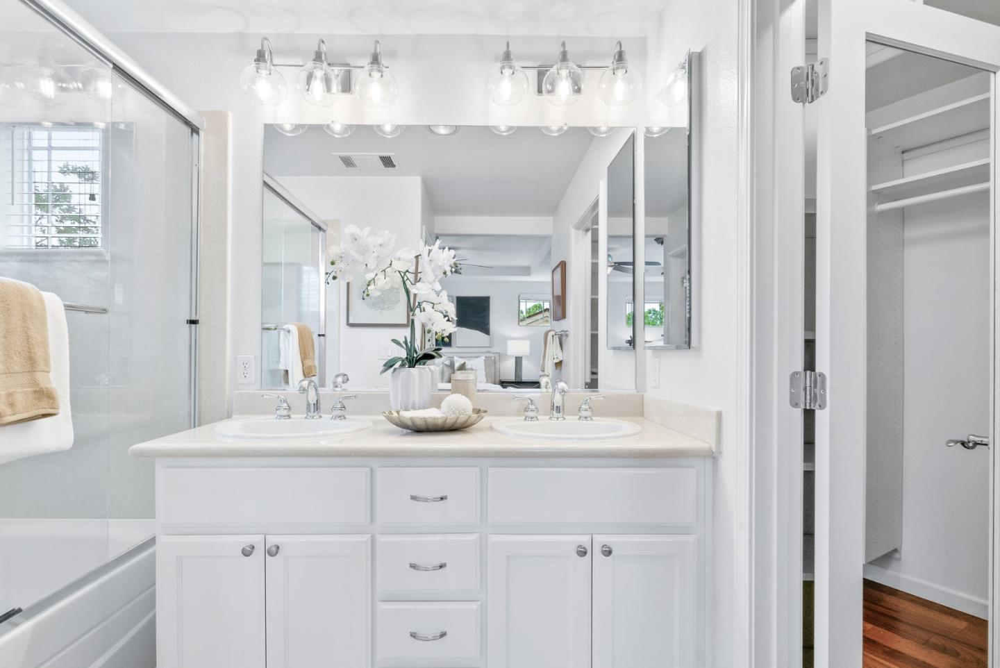 4334 Watson Circle Santa Clara, CA 95054 - Photo 28 of 38 a bathroom with a sink vanity granite tub shower and a mirror