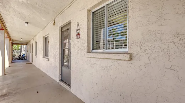a view of a hallway with windows