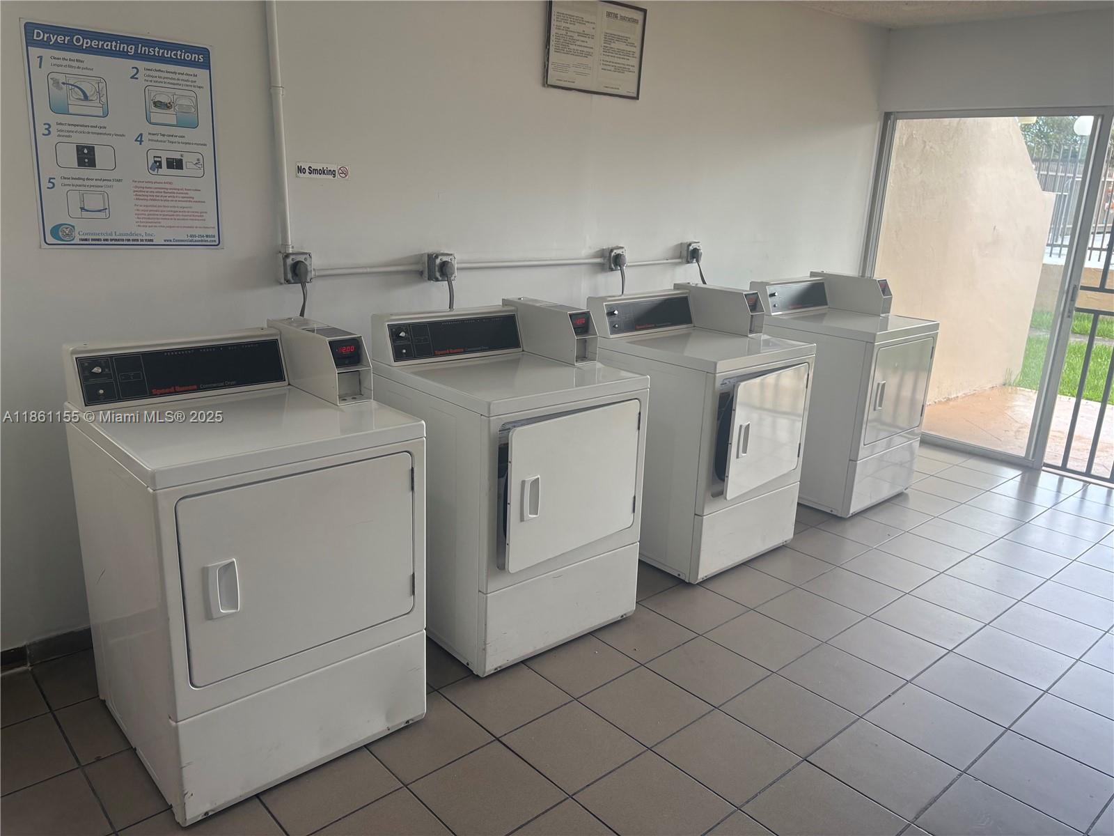 8889 Fontainebleau Boulevard, Unit 204 Miami, FL 33172 - Photo 24 of 28 a utility room with dryer and washer