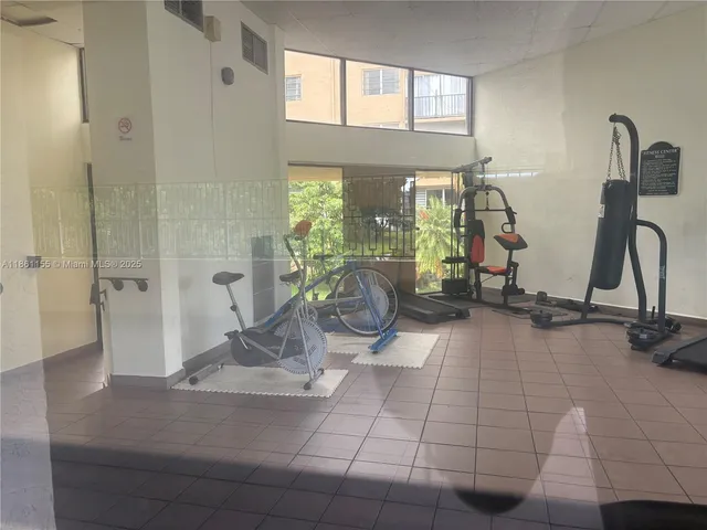 a view of a living room and a balcony