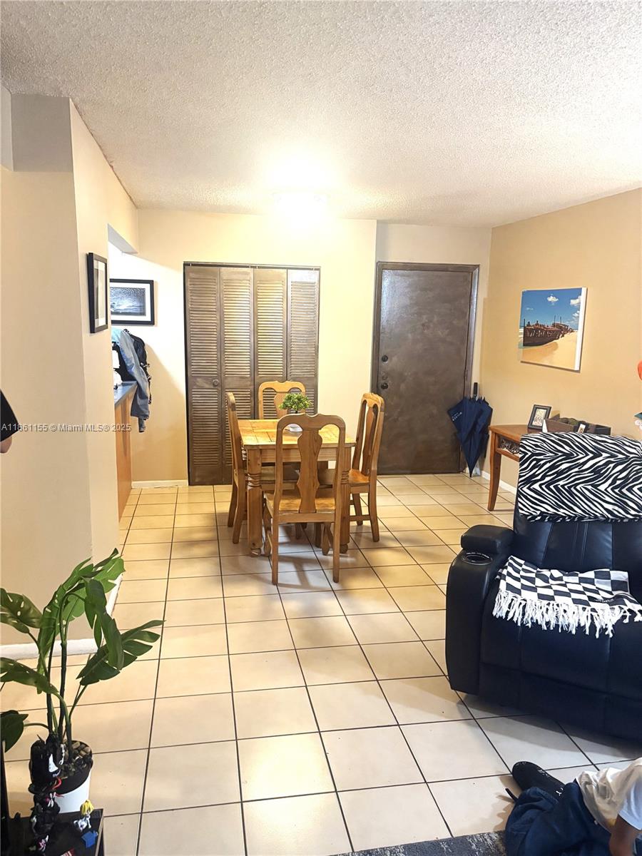 8889 Fontainebleau Boulevard, Unit 204 Miami, FL 33172 - Photo 5 of 28 a living room with furniture