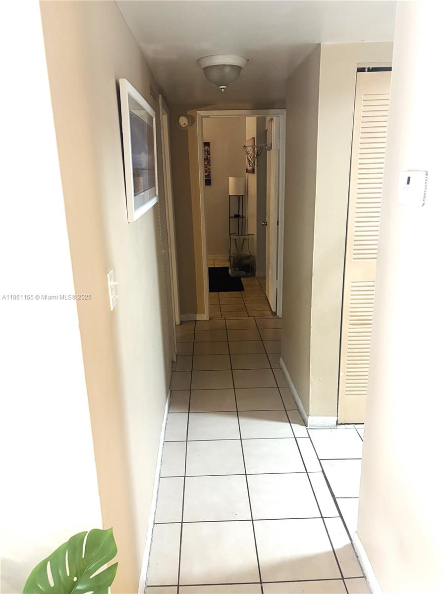 8889 Fontainebleau Boulevard, Unit 204 Miami, FL 33172 - Photo 9 of 28 a view of a hallway