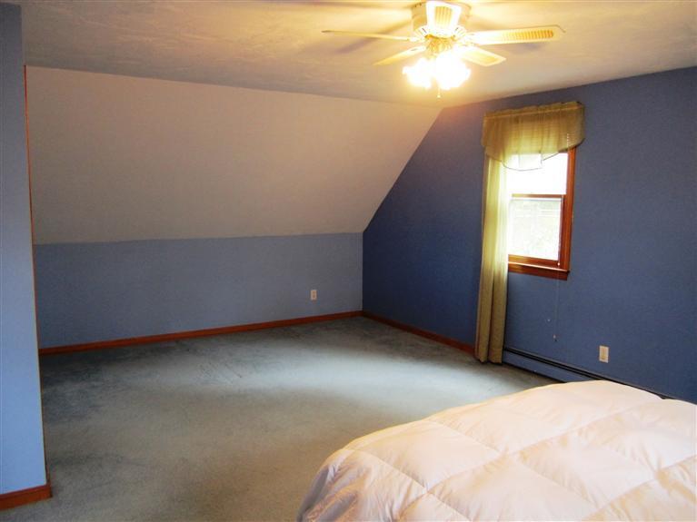 27 Pequot Road Mashpee, MA 02649 - Photo 20 of 35 a bedroom with a bed and a window