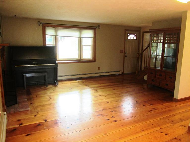 27 Pequot Road Mashpee, MA 02649 - Photo 4 of 35 a view of a livingroom with wooden floor and a window