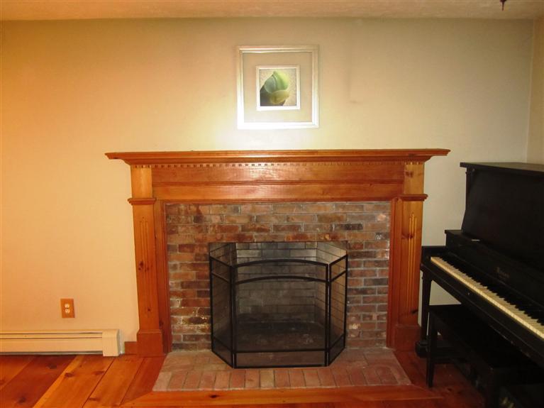 27 Pequot Road Mashpee, MA 02649 - Photo 6 of 35 a close view of a fireplace in the room