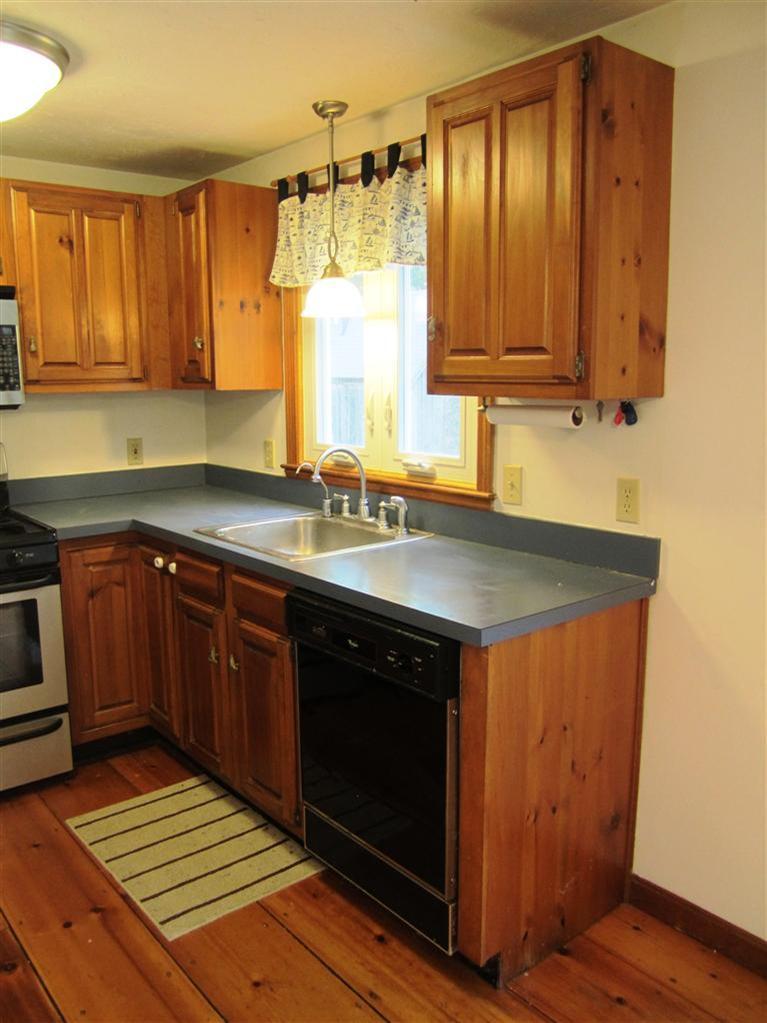 27 Pequot Road Mashpee, MA 02649 - Photo 10 of 35 a kitchen with a sink cabinets and window