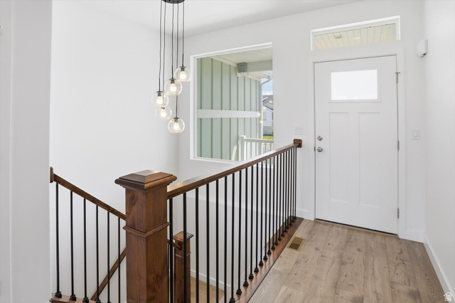 3636 West 910 South Syracuse, UT 84075 - Photo 45 of 70 Entryway featuring wood-finish flooring, a white paneled door with frosted glass, and a transom window