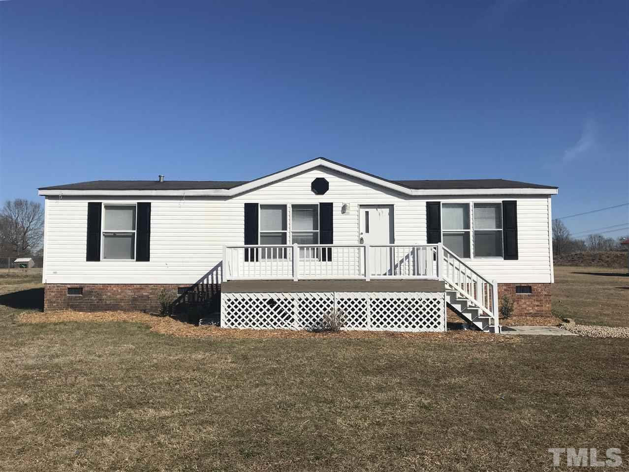 368 Massengill Pond Road Angier, NC 27501 - Photo 1 of 19 a front view of a house with a garden