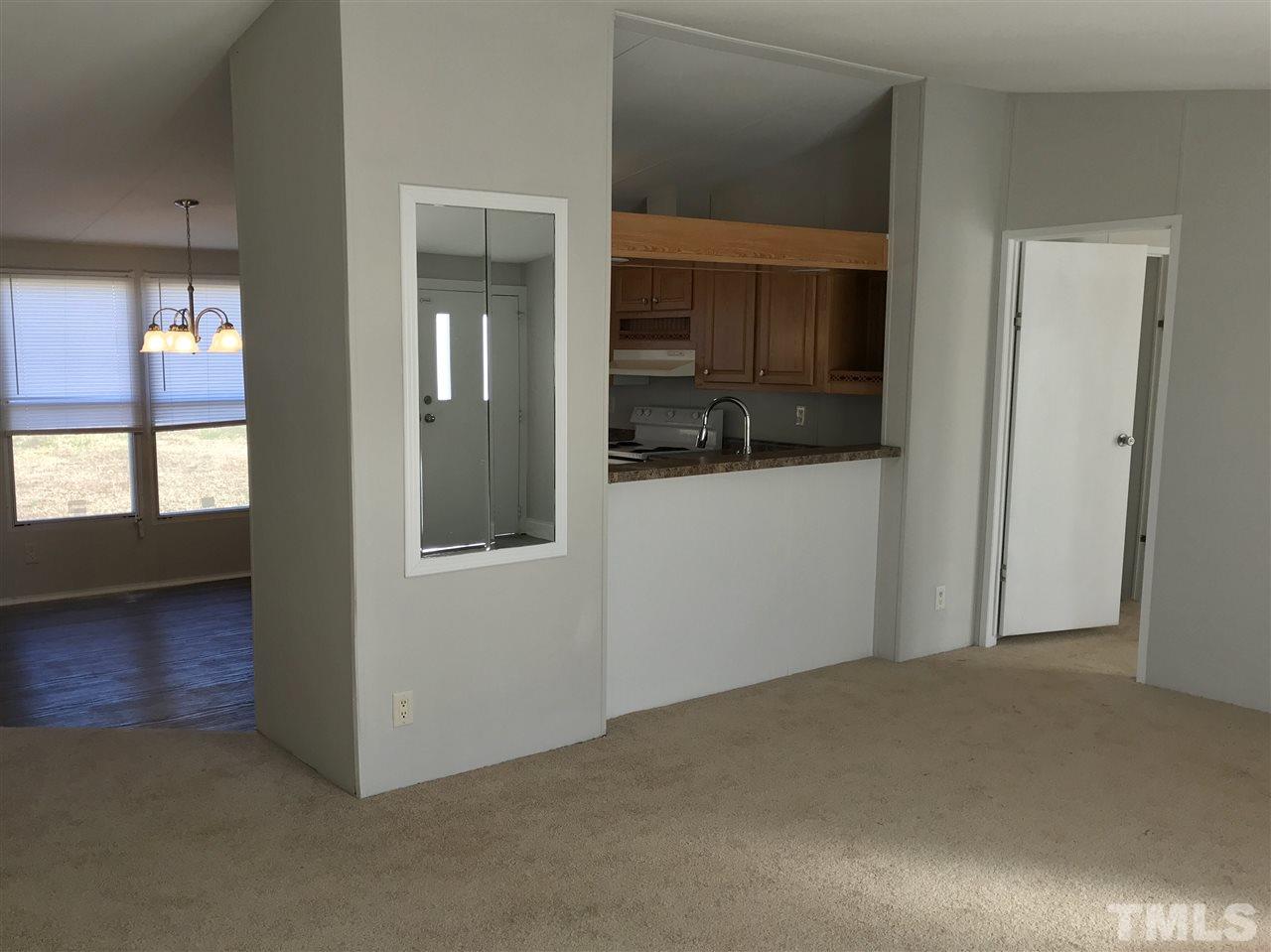 368 Massengill Pond Road Angier, NC 27501 - Photo 16 of 19 an empty room that has a window in it