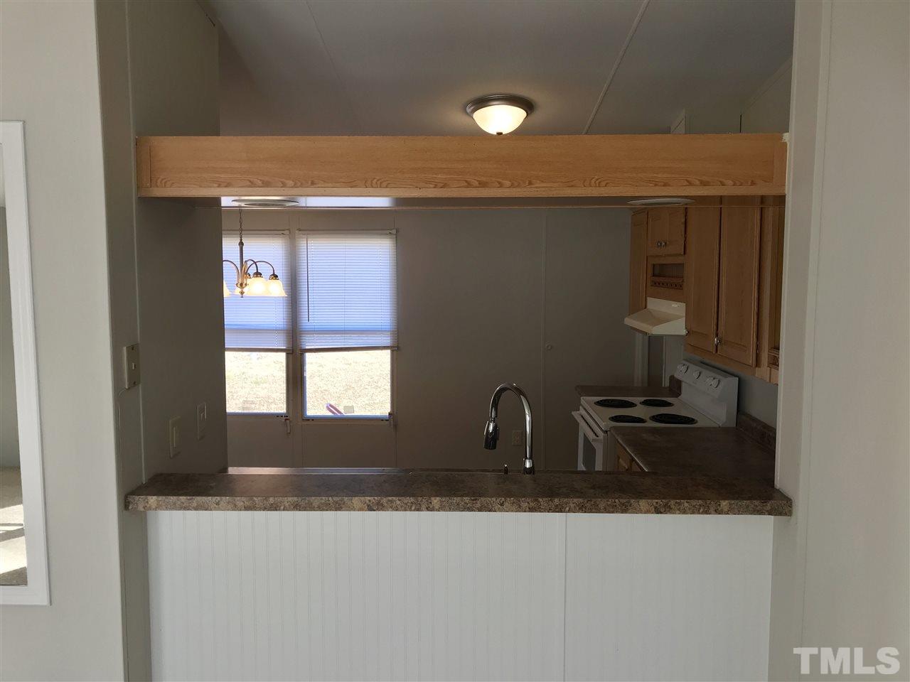 368 Massengill Pond Road Angier, NC 27501 - Photo 18 of 19 a kitchen with a sink and a window