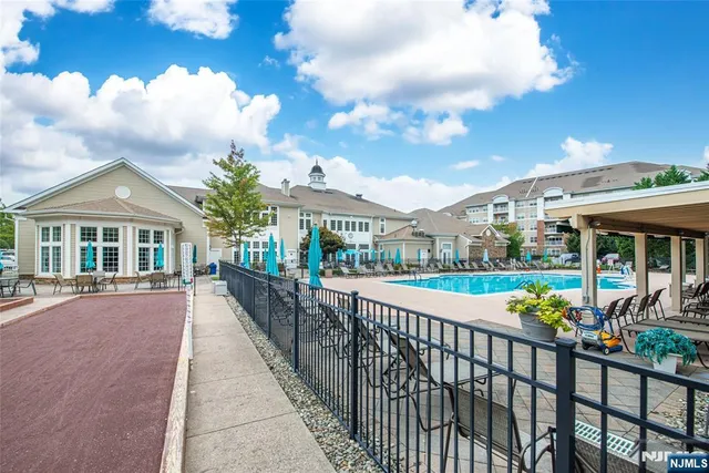 a view of large building a street and trees