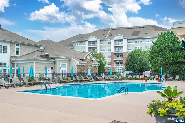 a view of pool with outdoor seating