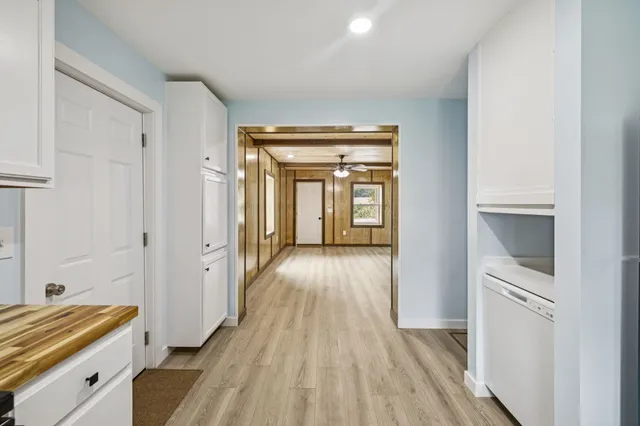 a kitchen with a refrigerator and cabinets