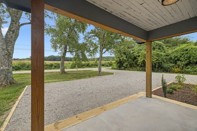 a view of hallway with wooden floor