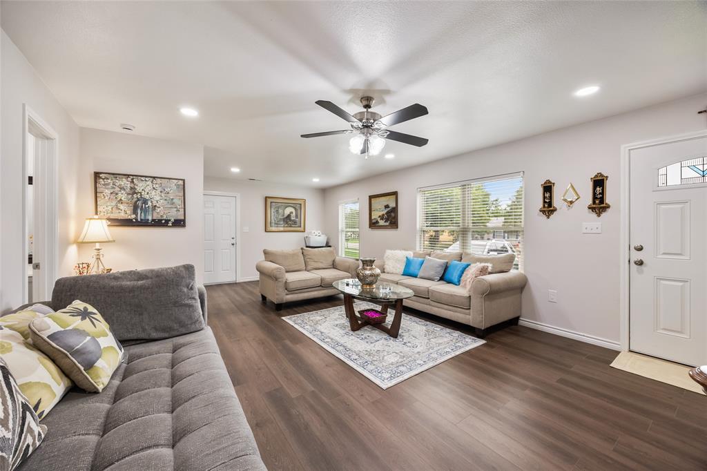 1005 Iowa Street Irving, TX 75060 - Photo 11 of 23 a living room with furniture and wooden floor