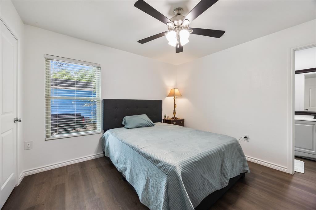 1005 Iowa Street Irving, TX 75060 - Photo 17 of 23 a bedroom with a large bed and a window