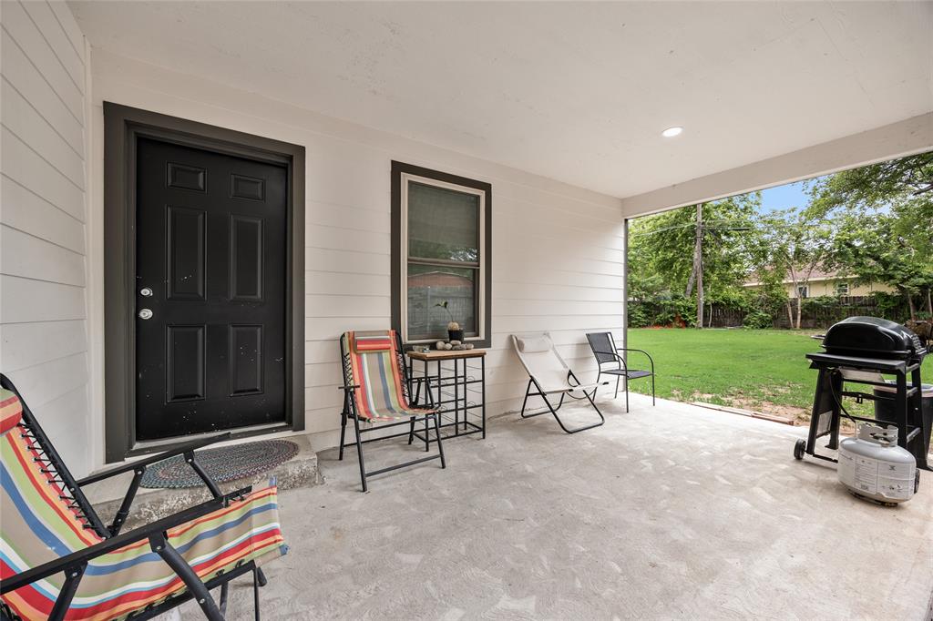 1005 Iowa Street Irving, TX 75060 - Photo 20 of 23 a view of chairs and tables in backyard