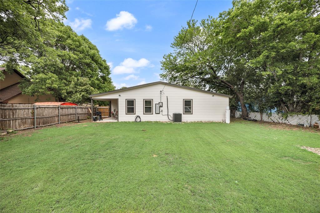 1005 Iowa Street Irving, TX 75060 - Photo 21 of 23 a view of a house with backyard and garden