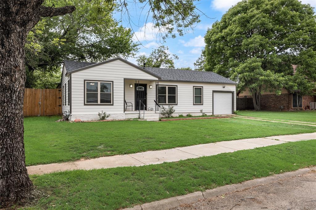 1005 Iowa Street Irving, TX 75060 - Photo 23 of 23 a front view of house with yard and green space