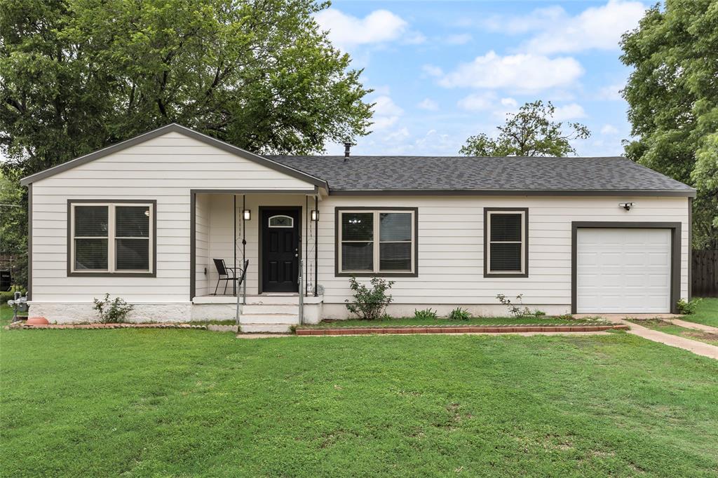 1005 Iowa Street Irving, TX 75060 - Photo 4 of 23 a front view of house with yard and green space