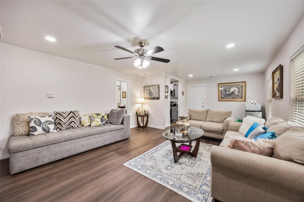 1005 Iowa Street Irving, TX 75060 - Photo 5 of 23 a living room with furniture and wooden floor