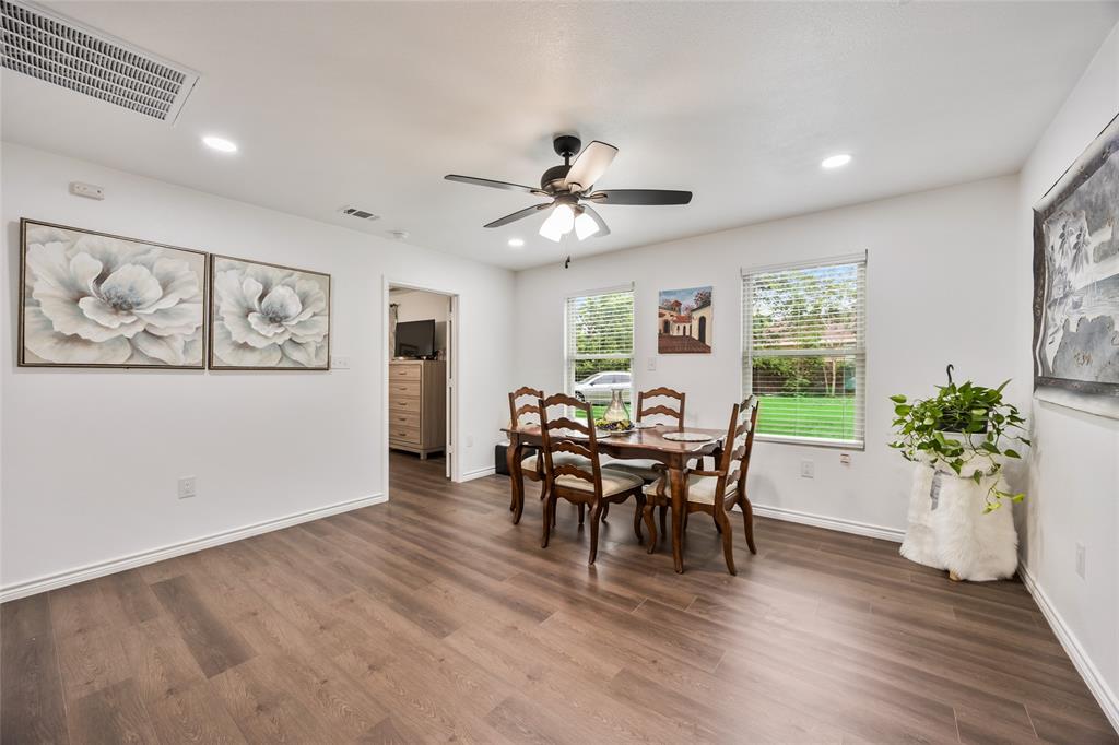 1005 Iowa Street Irving, TX 75060 - Photo 6 of 23 a view of a dining room with furniture window and wooden floor