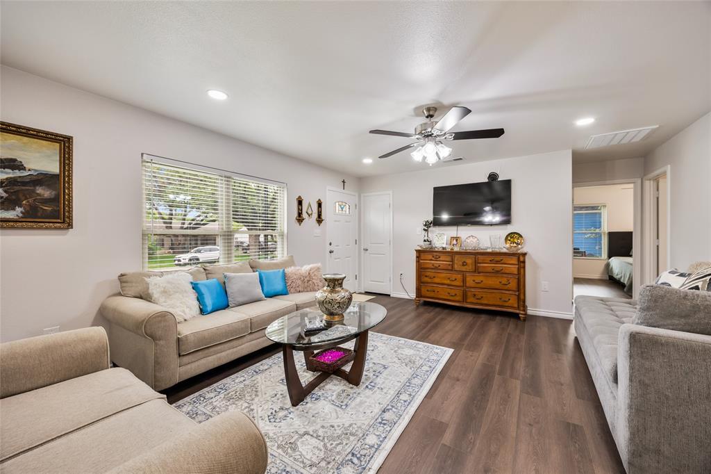 1005 Iowa Street Irving, TX 75060 - Photo 10 of 23 a living room with furniture and wooden floor