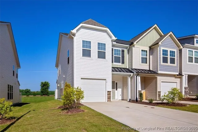 a front view of a house with yard