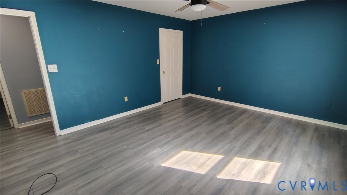 9514 Squirrel Level Road Petersburg, VA 23803 - Photo 12 of 32 Primary Bedroom with Vinyl Flooring!
