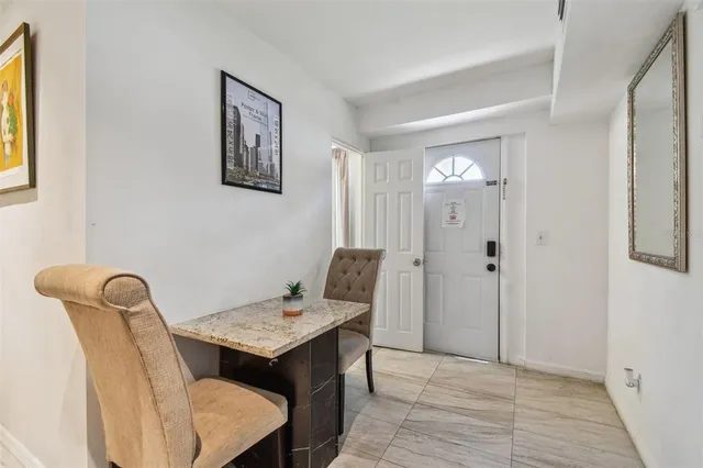 a view of a hallway with seating area