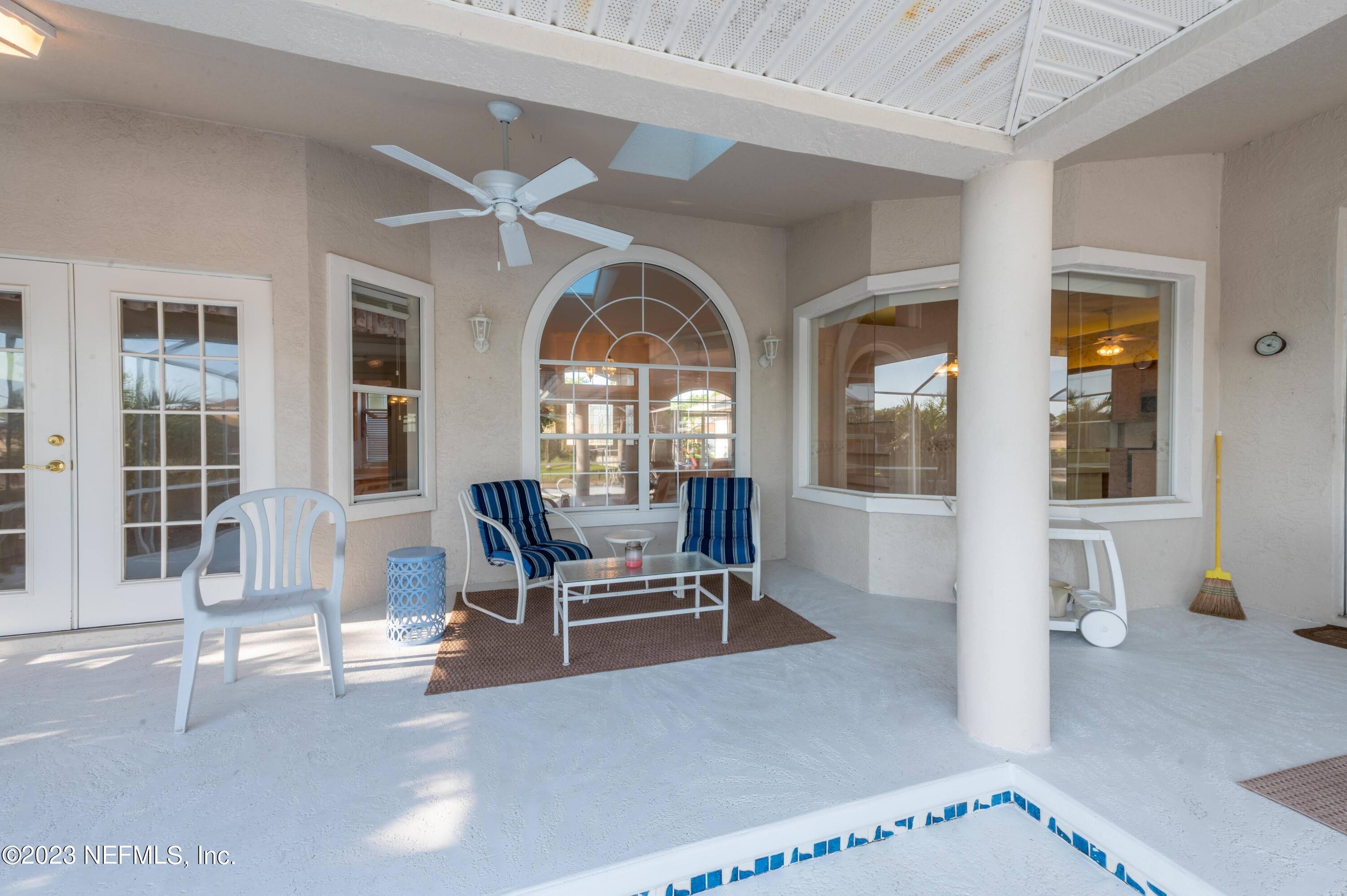 13 Clear Court Palm Coast, FL 32137 - Photo 14 of 60 a living room with furniture and a large window
