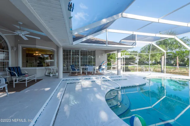 a front view of a house with plants