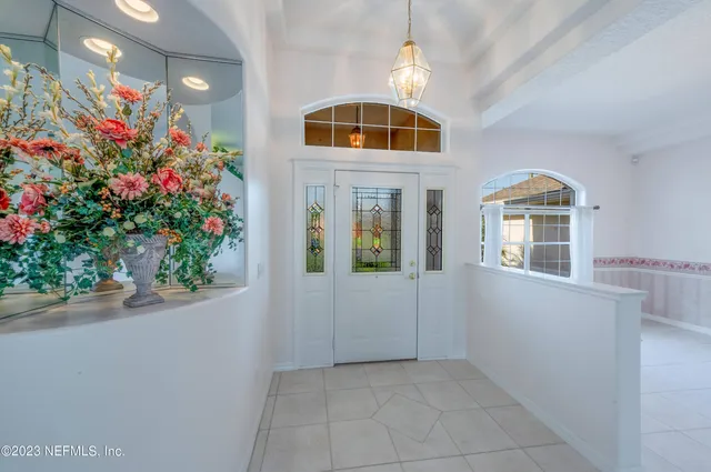 an empty room with windows and outdoor view