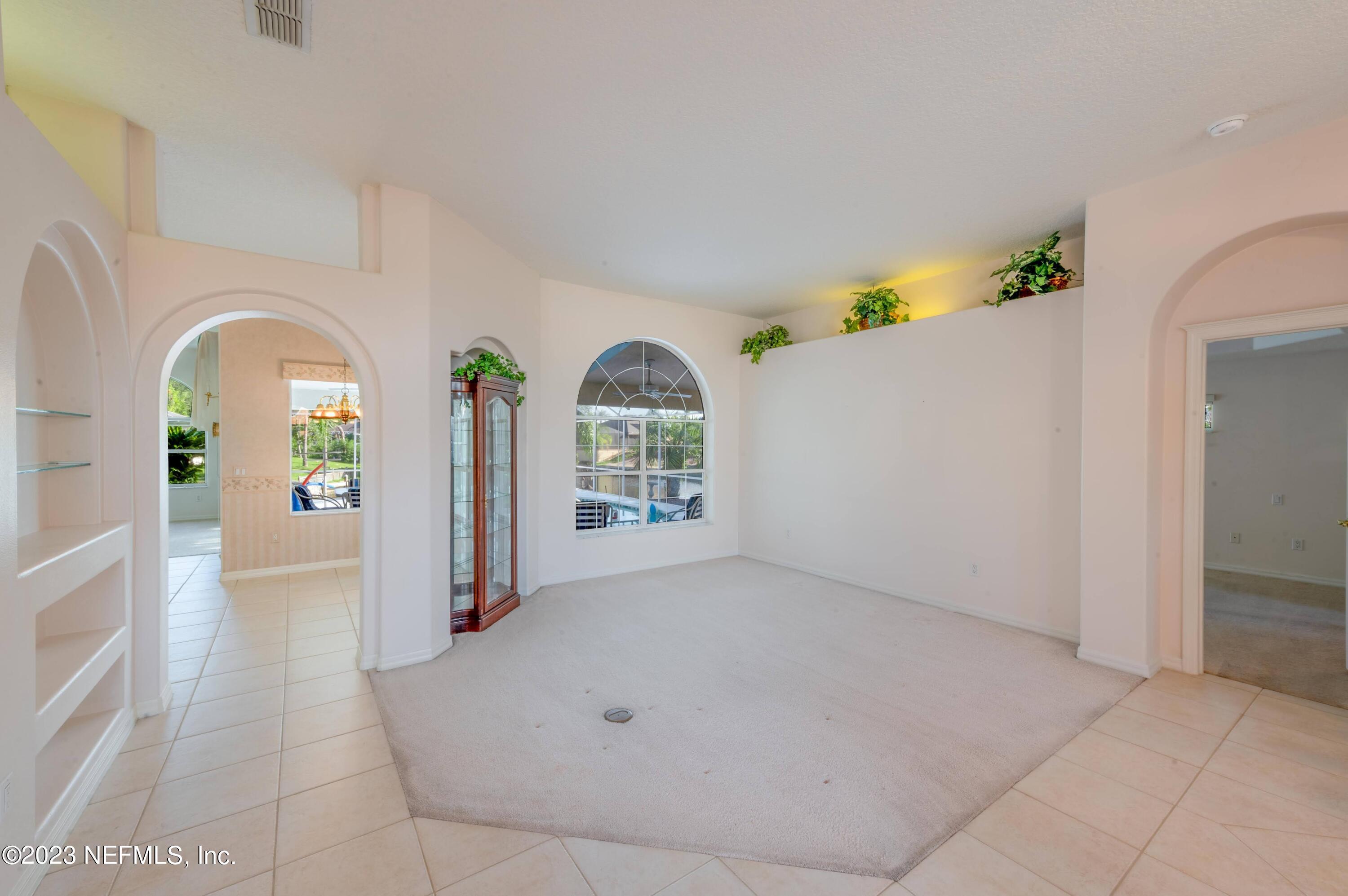 13 Clear Court Palm Coast, FL 32137 - Photo 26 of 60 2023_08_18 13 Clear Ct-214-front room