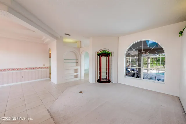a bathroom with a double vanity sink a mirror and a shower