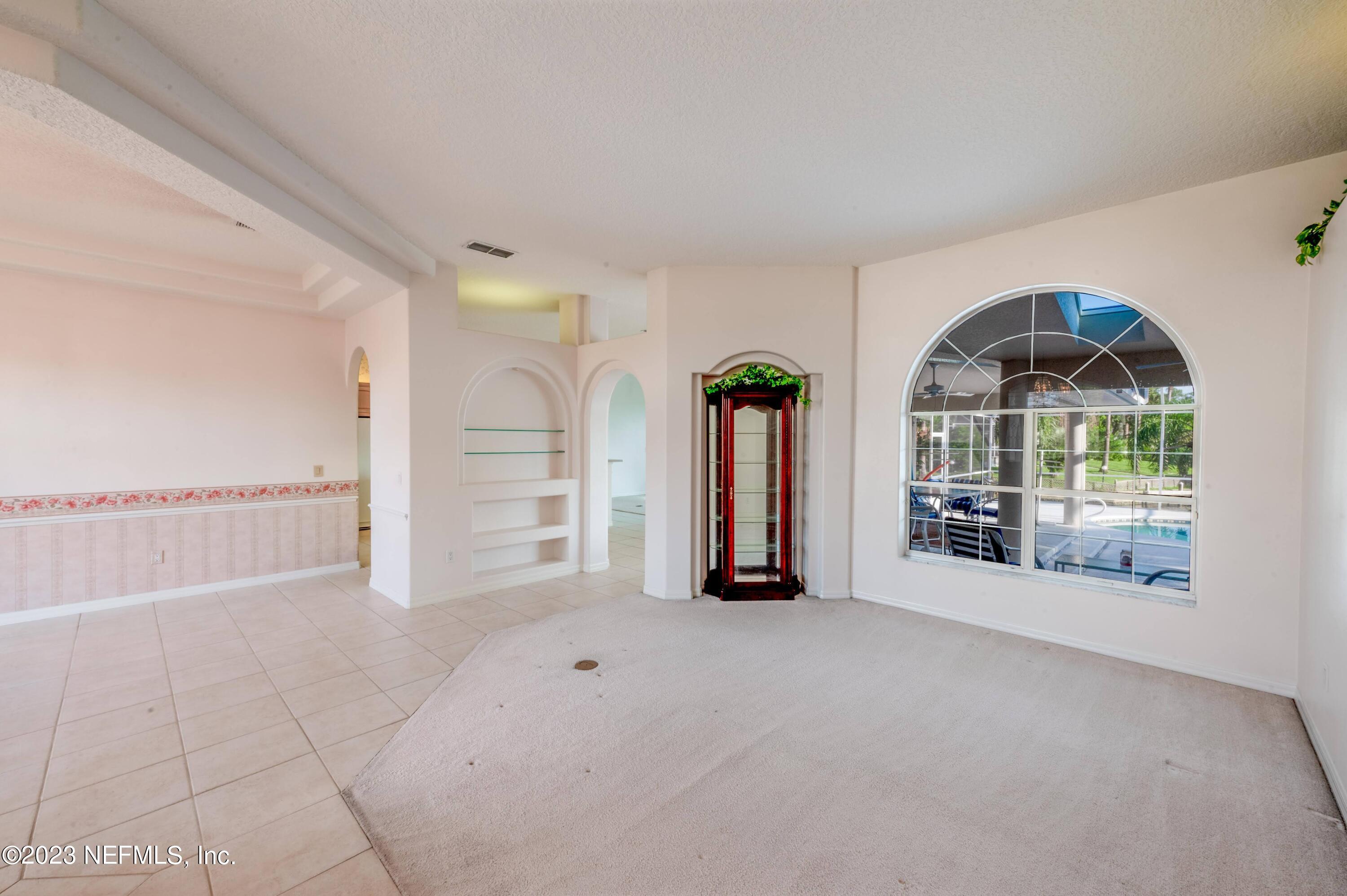 13 Clear Court Palm Coast, FL 32137 - Photo 29 of 60 a view of an empty room with a window