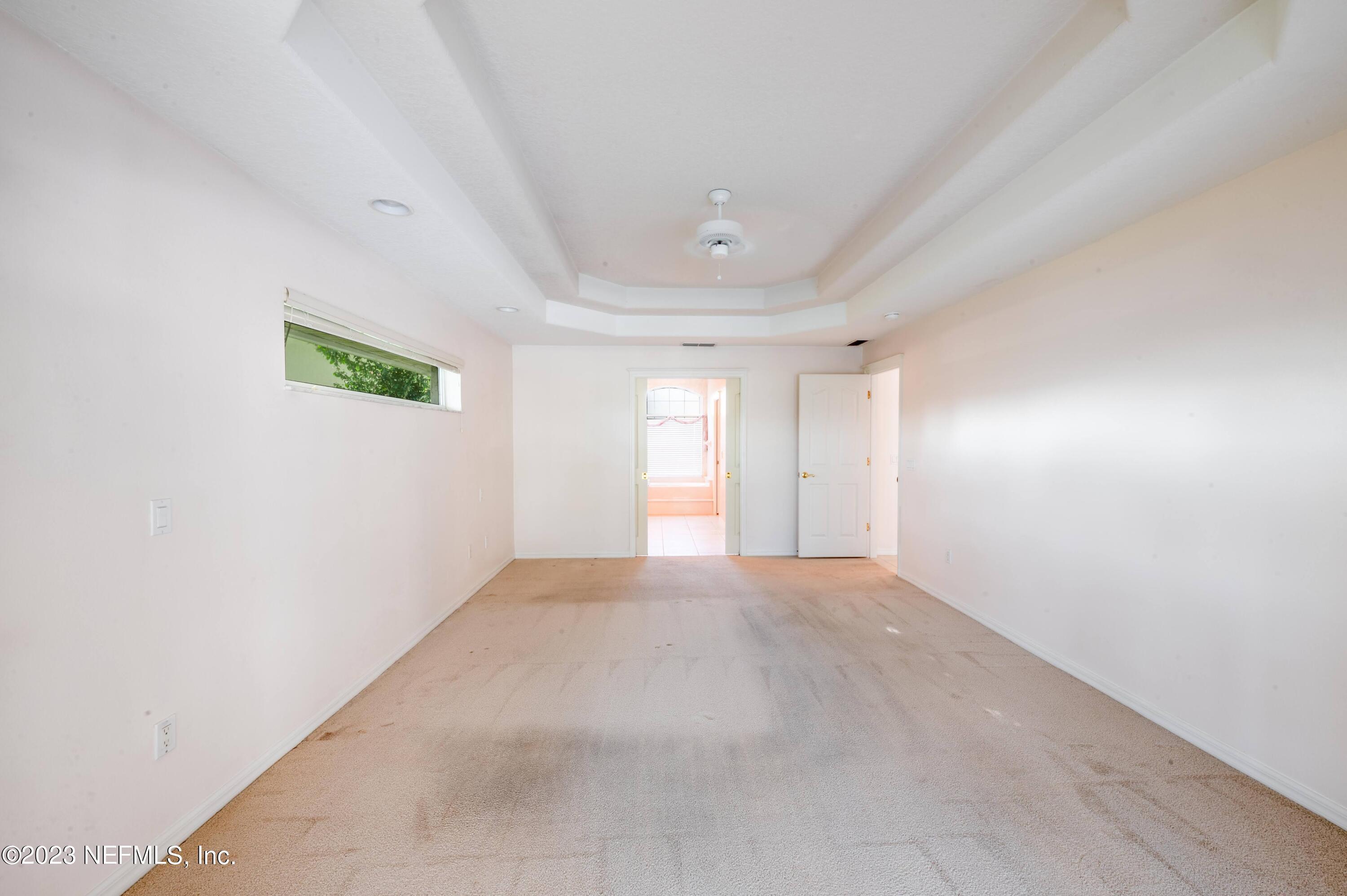 13 Clear Court Palm Coast, FL 32137 - Photo 32 of 60 an empty room with windows and closet