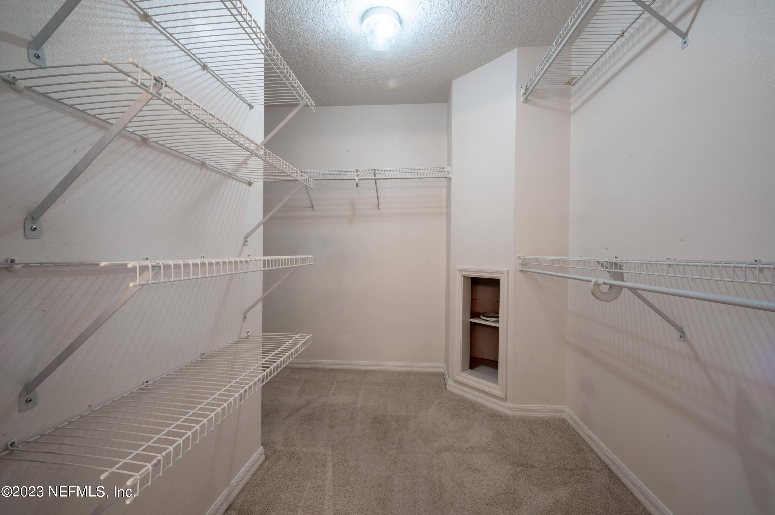 13 Clear Court Palm Coast, FL 32137 - Photo 37 of 60 a view of an empty walk in closet